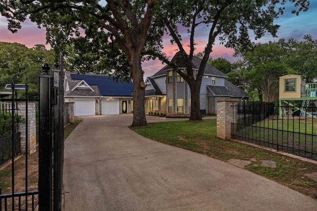1110 Old Dominion Pl, Mansfield, TX 76063 - traditional-style house with driveway, solar panels, an attached garage, and brick siding