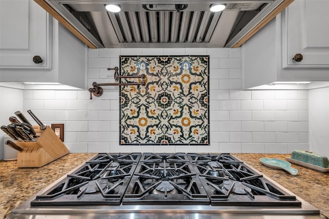 747 Kessler Lake Dr, Dallas, TX 75208 - kitchen with range hood, cooktop, decorative backsplash, and light stone counters