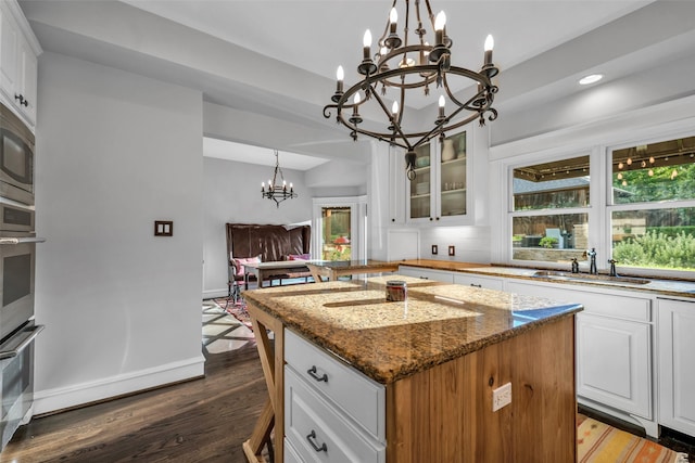 747 Kessler Lake Dr, Dallas, TX 75208 - kitchen with a chandelier, a center island, a sink, plenty of natural light, and recessed lighting