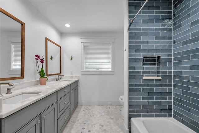 747 Kessler Lake Dr, Dallas, TX 75208 - bathroom featuring double vanity, toilet, baseboards, tub / shower combination, and recessed lighting