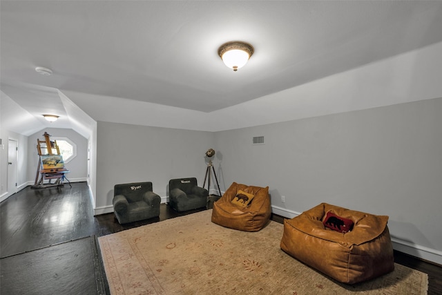 747 Kessler Lake Dr, Dallas, TX 75208 - living area with dark wood finished floors, vaulted ceiling, and baseboards