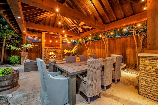 747 Kessler Lake Dr, Dallas, TX 75208 - view of patio featuring a large fireplace, a gazebo, a ceiling fan, a fenced backyard, and outdoor dining area