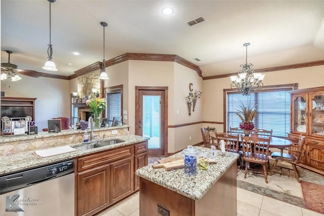 5158 Spring Creek Rd, Abilene, TX 79602 - kitchen with dishwasher, a sink, light tile patterned floors, brown cabinetry, and recessed lighting