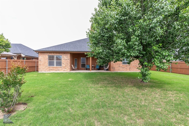 5158 Spring Creek Rd, Abilene, TX 79602 - back of house featuring brick siding, a patio area, and roof with shingles