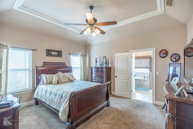 5158 Spring Creek Rd, Abilene, TX 79602 - bedroom with a tray ceiling, light carpet, ornamental molding, ensuite bathroom, and baseboards
