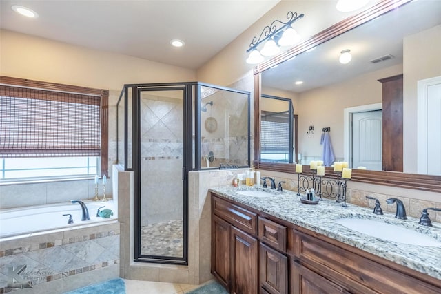 5158 Spring Creek Rd, Abilene, TX 79602 - bathroom featuring a shower stall, healthy amount of natural light, a bath, double vanity, and recessed lighting