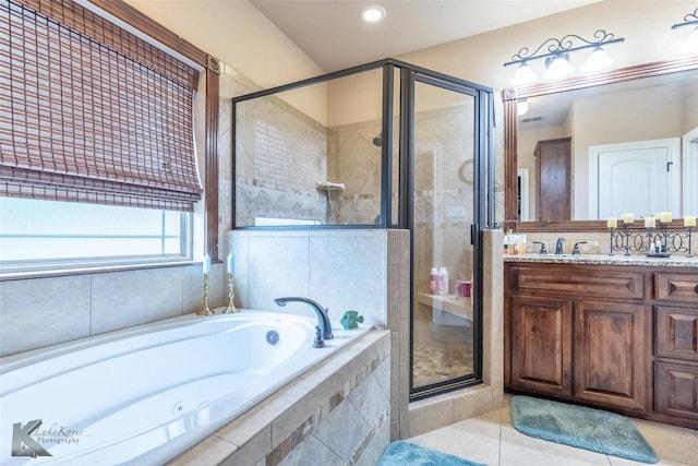 5158 Spring Creek Rd, Abilene, TX 79602 - full bathroom with a shower stall, a garden tub, vanity, tile patterned flooring, and recessed lighting