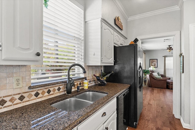 1590 N Hills Dr, Rockwall, TX 75087 - kitchen with a sink, wood finished floors, backsplash, ornamental molding, and white cabinetry