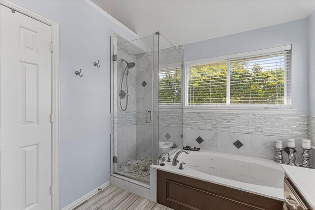 1590 N Hills Dr, Rockwall, TX 75087 - full bathroom with a bath, a shower stall, and baseboards