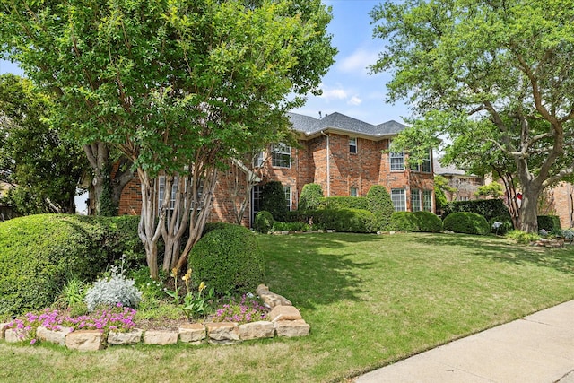 1590 N Hills Dr, Rockwall, TX 75087 - view of front of property with brick siding and a front yard