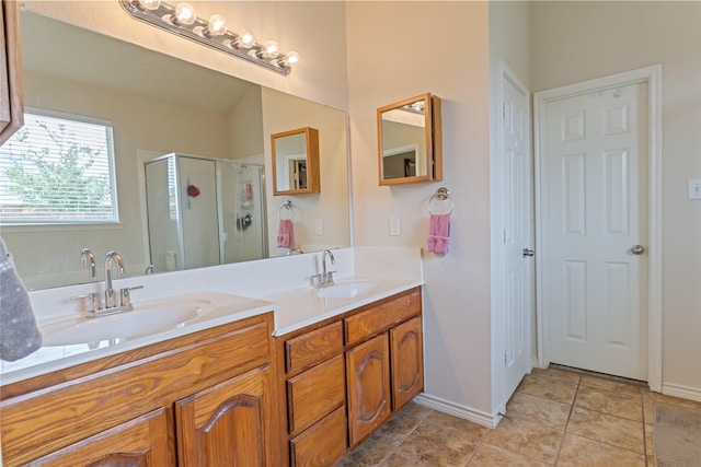 3066 Stoney Hollow Ln, Rockwall, TX 75087 - bathroom featuring a stall shower, double vanity, and baseboards