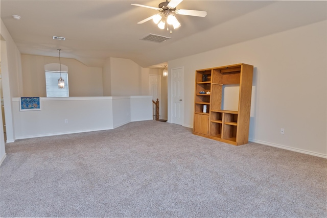 3066 Stoney Hollow Ln, Rockwall, TX 75087 - spare room with lofted ceiling, carpet floors, a ceiling fan, baseboards, and built in features