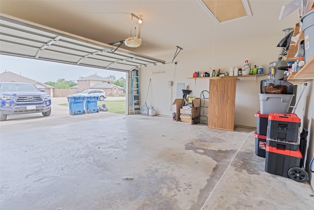 3066 Stoney Hollow Ln, Rockwall, TX 75087 - garage featuring a garage door opener