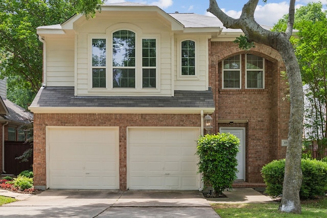4816 Rockcreek Ln, Plano, TX 75024 - traditional-style house featuring an attached garage, concrete driveway, and brick siding