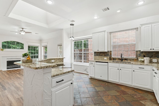 4816 Rockcreek Ln, Plano, TX 75024 - kitchen with dishwasher, a sink, plenty of natural light, decorative backsplash, and recessed lighting
