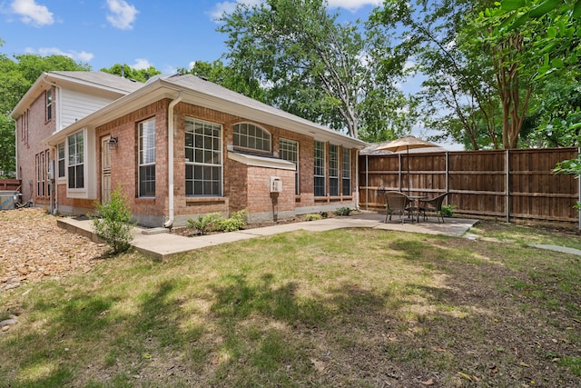 4816 Rockcreek Ln, Plano, TX 75024 - rear view of house with brick siding and a patio