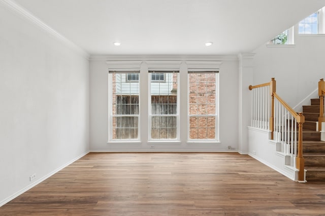 4816 Rockcreek Ln, Plano, TX 75024 - spare room with stairway, wood finished floors, ornamental molding, baseboards, and recessed lighting