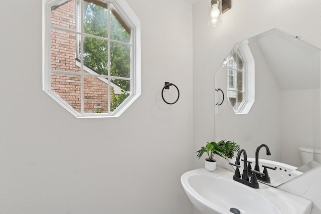 4816 Rockcreek Ln, Plano, TX 75024 - half bathroom with a sink and healthy amount of natural light