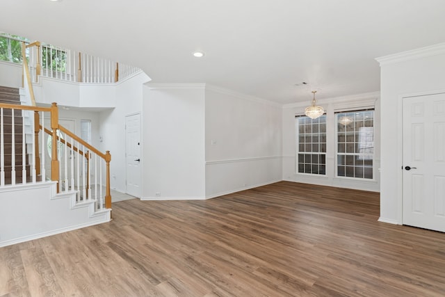 4816 Rockcreek Ln, Plano, TX 75024 - unfurnished living room with stairs, wood finished floors, ornamental molding, a chandelier, and baseboards