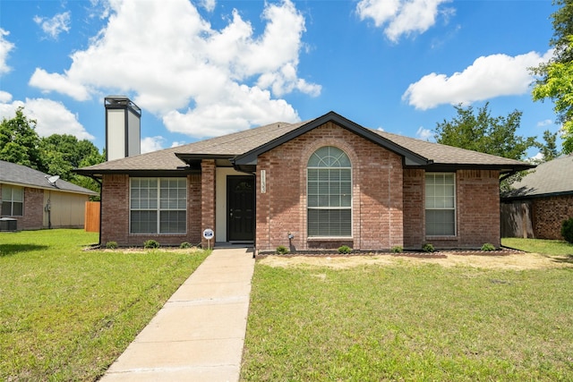 1133 Rosewood Ln, Lancaster, TX 75146 - ranch-style home with a front lawn, a chimney, brick siding, cooling unit, and a shingled roof