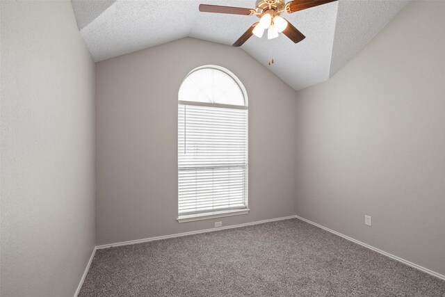 1133 Rosewood Ln, Lancaster, TX 75146 - carpeted spare room with a ceiling fan, lofted ceiling, a textured ceiling, and baseboards