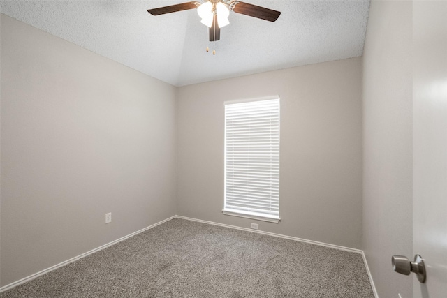 1133 Rosewood Ln, Lancaster, TX 75146 - carpeted spare room featuring a ceiling fan, baseboards, vaulted ceiling, and a textured ceiling