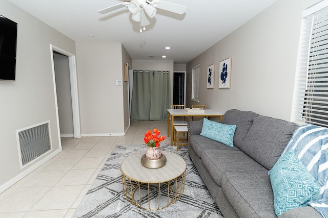 living room with light tile patterned floors, ceiling fan, baseboards, and recessed lighting