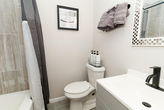 full bathroom with toilet, vanity, tile patterned flooring, and shower / tub combo