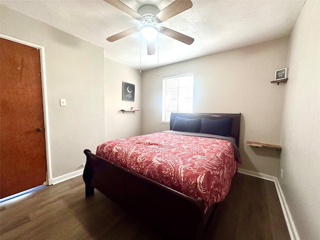 bedroom with wood finished floors, baseboards, and ceiling fan