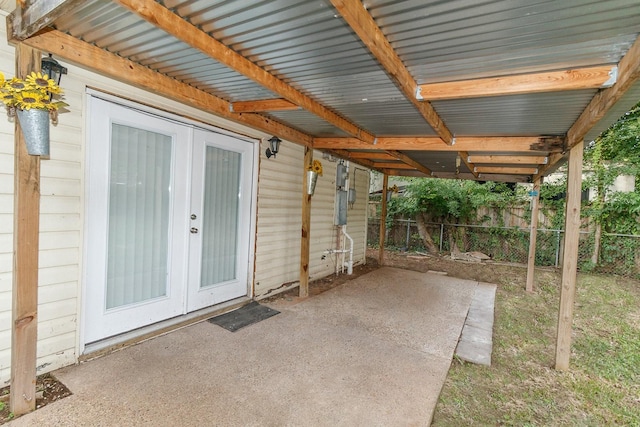 view of patio / terrace featuring french doors and fence