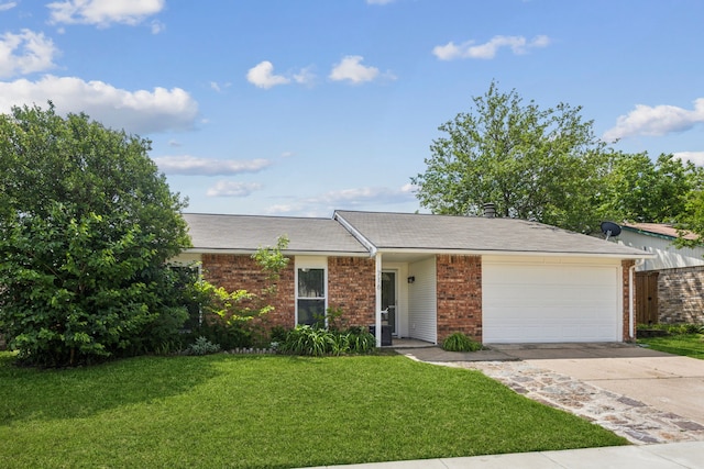single story home with brick siding, driveway, a garage, and a front lawn