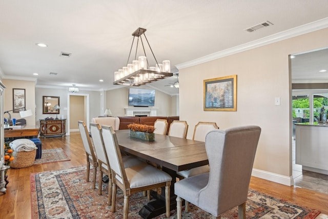 4222 Laren Ln, Dallas, TX 75244 - dining space with ceiling fan, ornamental molding, light wood-style flooring, baseboards, and recessed lighting