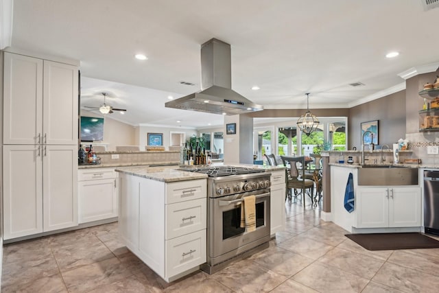 4222 Laren Ln, Dallas, TX 75244 - kitchen featuring appliances with stainless steel finishes, island range hood, a sink, tasteful backsplash, and white cabinets
