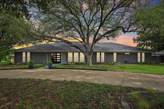 4222 Laren Ln, Dallas, TX 75244 - view of front of home with brick siding and a lawn