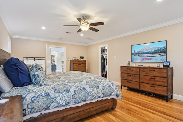 4222 Laren Ln, Dallas, TX 75244 - bedroom with ornamental molding, wood finished floors, a spacious closet, recessed lighting, and ceiling fan