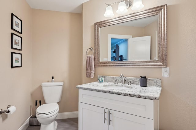 4222 Laren Ln, Dallas, TX 75244 - bathroom with baseboards, toilet, a chandelier, vanity, and wood finished floors