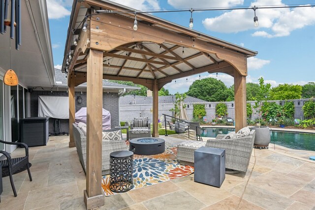 4222 Laren Ln, Dallas, TX 75244 - view of patio / terrace with a fire pit, a gazebo, and a fenced backyard