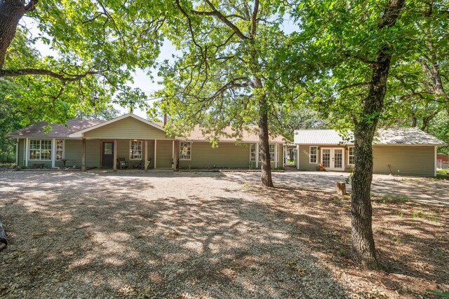 168 Barker Ln, Waco, TX 76705 - rear view of property with french doors and driveway