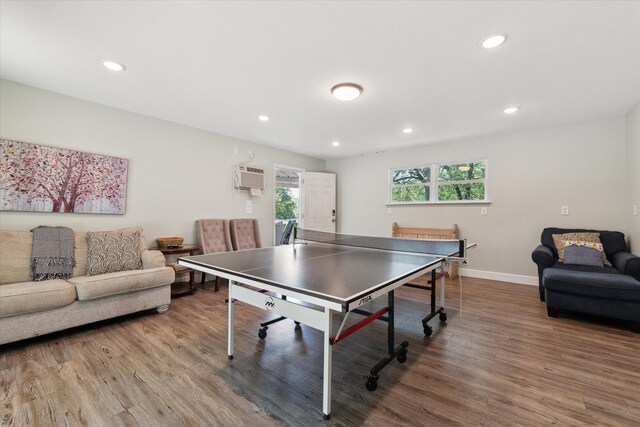 168 Barker Ln, Waco, TX 76705 - rec room featuring wood finished floors, recessed lighting, baseboards, and a wall mounted AC