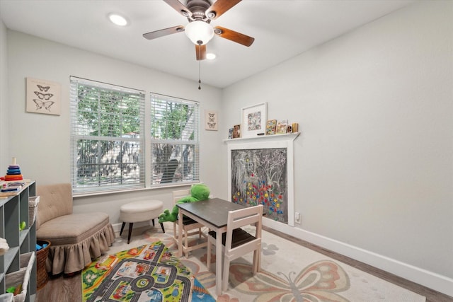 168 Barker Ln, Waco, TX 76705 - playroom featuring light wood-style flooring, baseboards, and ceiling fan