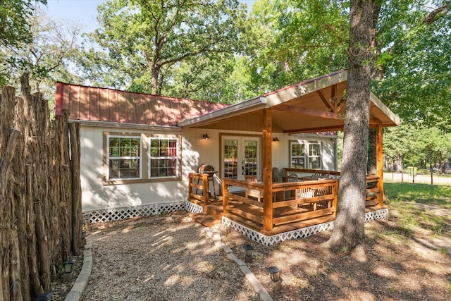 168 Barker Ln, Waco, TX 76705 - rear view of house with french doors and a wooden deck