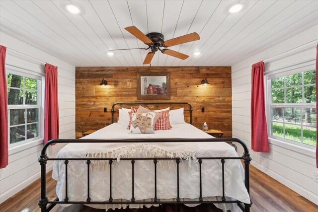 168 Barker Ln, Waco, TX 76705 - bedroom featuring recessed lighting, multiple windows, wood walls, wood finished floors, and a ceiling fan