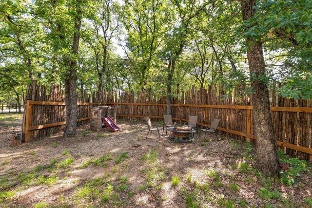 168 Barker Ln, Waco, TX 76705 - view of yard with fence and an outdoor fire pit