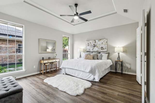 2111 Rheims Dr, Carrollton, TX 75006 - bedroom with a tray ceiling, wood finished floors, baseboards, and a ceiling fan