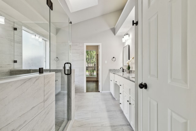 2111 Rheims Dr, Carrollton, TX 75006 - bathroom featuring marble look tile flooring, vanity, a shower stall, a skylight, and baseboards