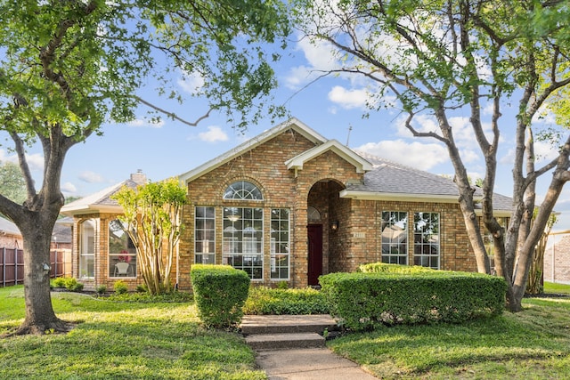 2111 Rheims Dr, Carrollton, TX 75006 - traditional-style home featuring brick siding and a shingled roof
