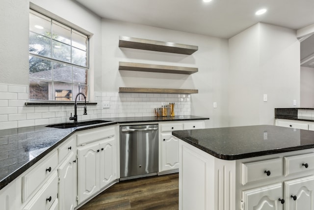 2111 Rheims Dr, Carrollton, TX 75006 - kitchen with dishwasher, a sink, dark wood-style floors, tasteful backsplash, and white cabinetry