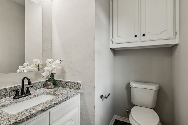 2111 Rheims Dr, Carrollton, TX 75006 - half bathroom featuring toilet and vanity