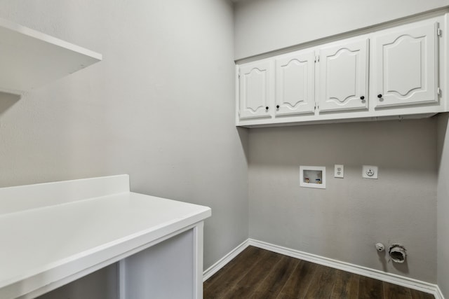 2111 Rheims Dr, Carrollton, TX 75006 - laundry area featuring dark wood-style flooring, baseboards, cabinet space, washer hookup, and gas dryer hookup
