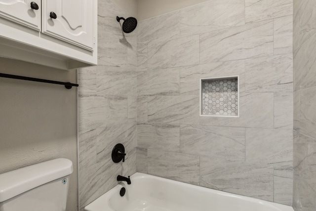 2111 Rheims Dr, Carrollton, TX 75006 - bathroom featuring toilet and shower / washtub combination